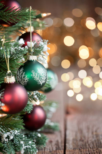 istock Christmas Tree, Red and Green Ornaments against a Defocused Lights Background 1286364560