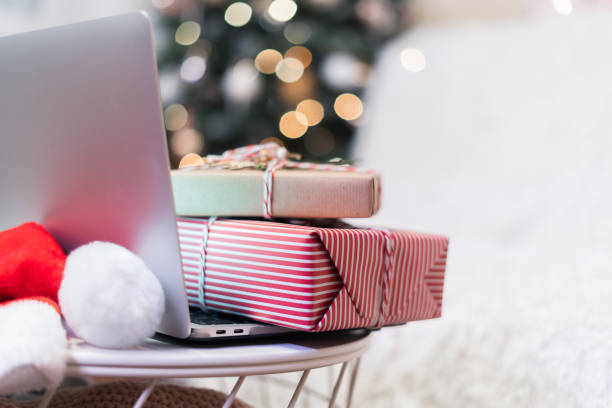 istock Christmas gift boxeson laptop, online shopping concept. 1286367355