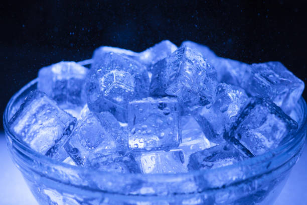 istock Bowl of wet ice close-up with water drops falling over 1286367480