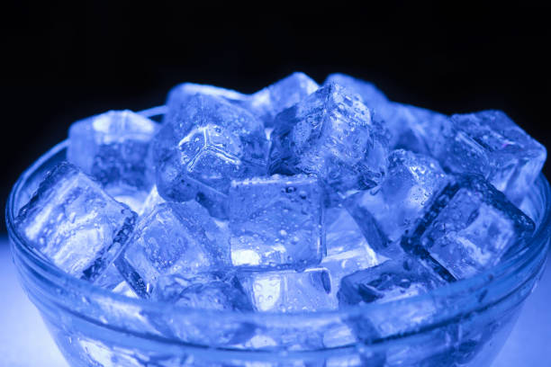 istock Bowl of wet ice close-up with dark background 1286367492