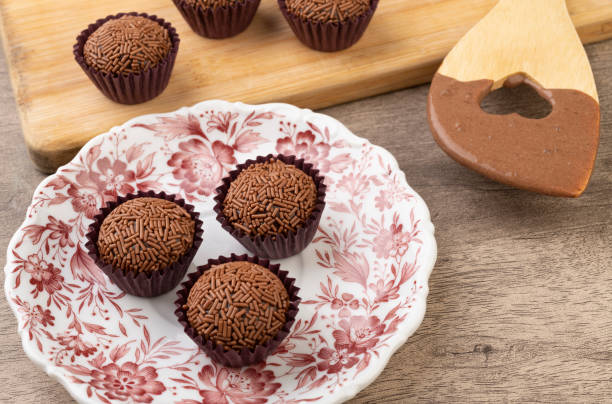 istock Typical Brazilian brigadeiros with spoon over wooden table 1286368319