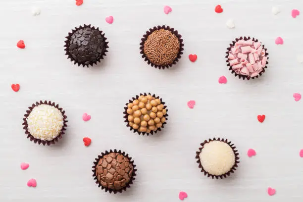 Typical brazilian brigadeiros, various flavors with tiny hearts.