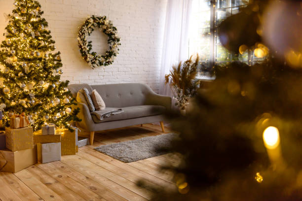 istock Beautiful holdiay decorated room with Christmas tree with presents under it 1286368985