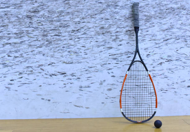 squash racket and ball at court in training club. sports equipment and sportswear for playing squash - slenderize imagens e fotografias de stock