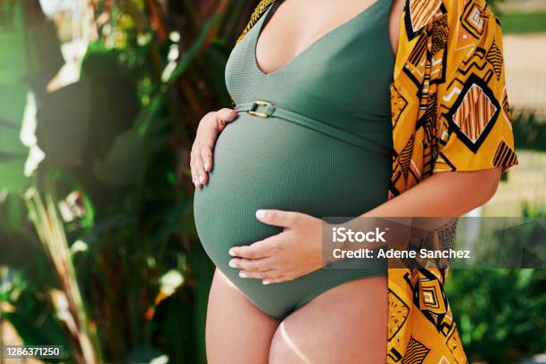 My Baby Bump Is My Best Accessory Stock Photo - Download Image Now - Pregnant, Swimwear, Women