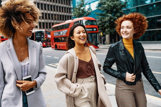 istock Diverse millennials walking down the street 1286371415