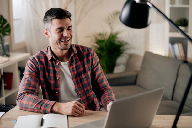 istock Young man working at home stock photo 1286373289