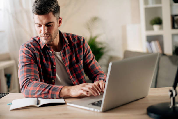 istock Young man working at home stock photo 1286373940