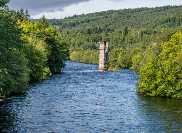 River Oich, Fort Augustus, Highlands, Scotland River Oich and the remains of the old bridge, Fort Augustus, Highlands, Scotland fort augustus stock pictures, royalty-free photos & images