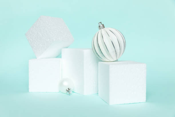 istock Simply minimal composition winter objects ornament and cube shapes geometric form podium isolated blue pastel background. Christmas New Year december time for celebration concept. Mockup, copy space 1286374611
