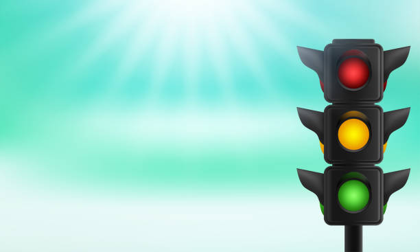 istock Traffic lights with all three colors on hanging against blue sky 1286375338