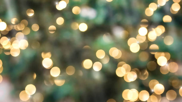 istock Abstract Green background with gold defocused Lights 1286375532
