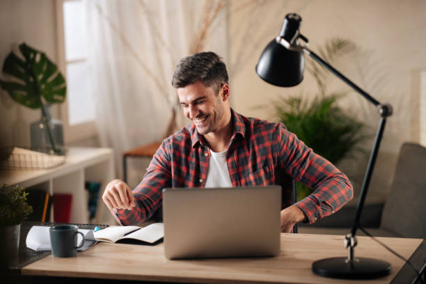 istock Young man working at home stock photo 1286376668