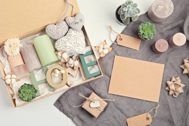 istock Preparing care package, seasonal gift box with candles, succulent, interior scent. Personalized eco friendly basket 1286378587