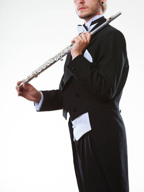 istock Male flutist wearing tailcoat holds flute 1286379654