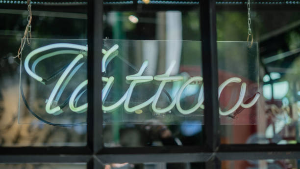 istock Blue Tattoo Light Sign from a Barber Shop and Tattoo Studio 1286380742