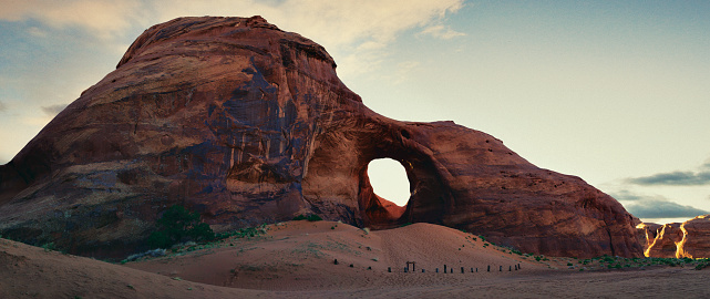 Panoramic shot of Ear of the Wind Arch in Monument Valley Navajo Tribal Reservation, Arizona, USA. Multiple files stitched.