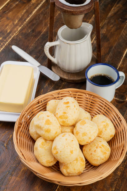 istock Typical brazilian cheese bun in a basket with coffee over wooden table 1286381908