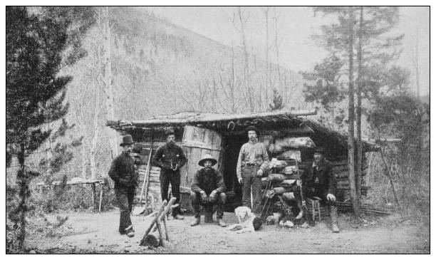 Antique black and white photo of the United States: Hunter's hut Antique black and white photo of the United States: Hunter's hut log cabin photos stock illustrations