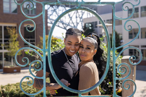 istock Two African American women outside together posing behind a frame 1286384920