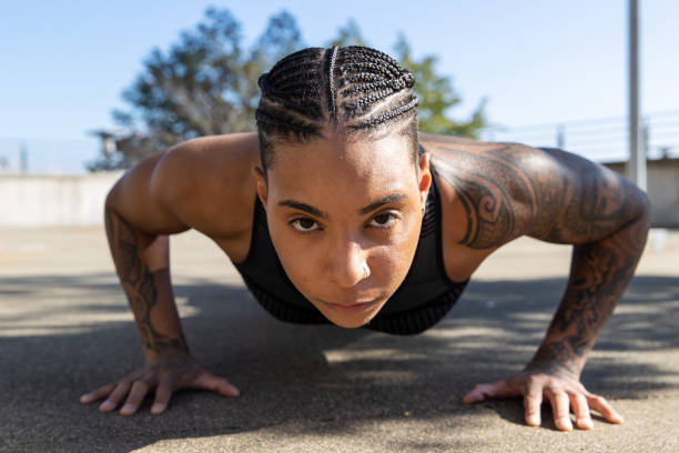 istock Strong African American woman doing push ups outside 1286384991