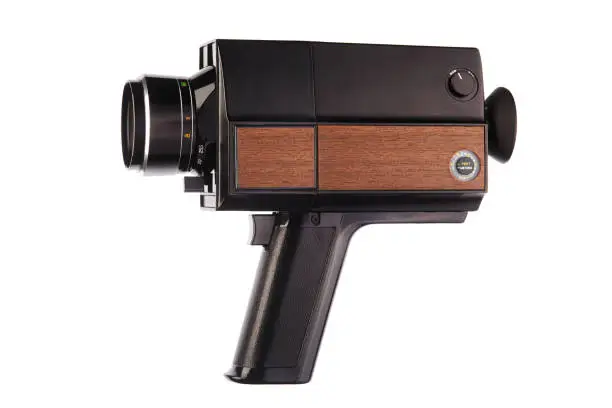 Photo of Old fashioned analog Super8, 8mm film movie camera on white background