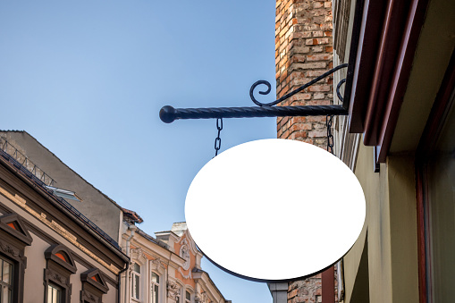 Mock up. Empty round signage on the wall of classical architecture building.