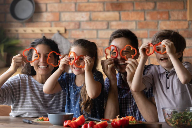 istock Overjoyed parents with kids have fun cooking 1286390262