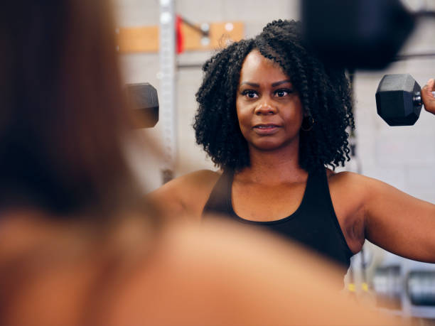 istock Woman Working Out in a Gym 1286391607