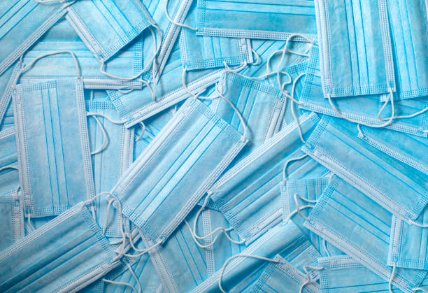 istock Medical blue protective masks, texture. Top view 1286394116
