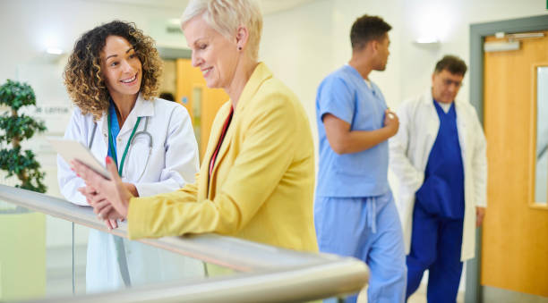 istock doctor chatting with business person 1286394281