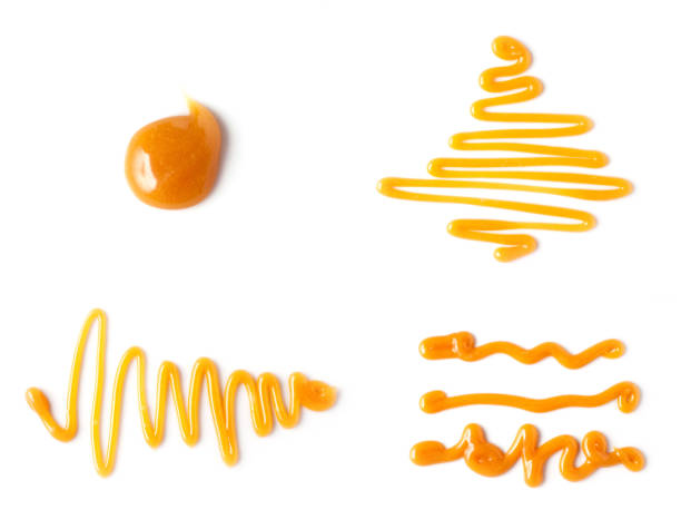 istock sweet caramel sauce isolated on white background, top view 1286397630