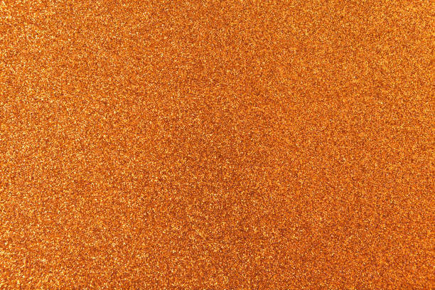 istock Shiny bronze leaf. Gold glitter texture. Christmas abstract background, defocused. Place for text 1286398668