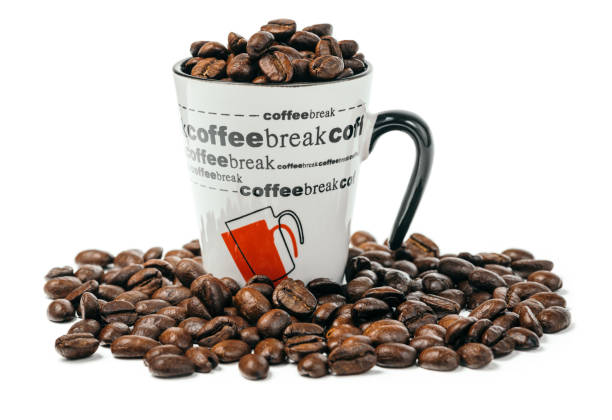 Coffee cup full of premium coffee beans stock photo