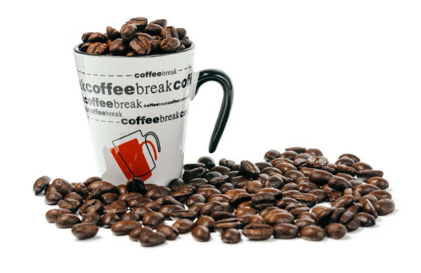 Coffee cup full of premium coffee beans stock photo