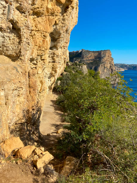 istock Route of the cliffs, destination Cala Llebeig. 1286401344