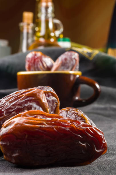 istock Big luxury dried date fruit on the dark surface, kurma ramadan kareem concept, close up. 1286401372