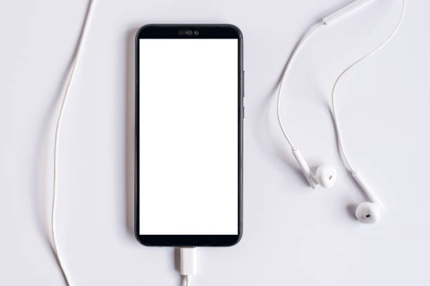istock Smartphone with earphones on white background 1286402289