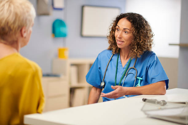 istock female doctor chatting to patient 1286402379