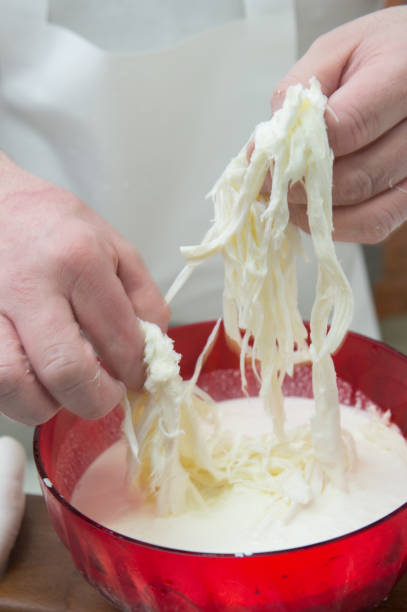 istock production of the typical apulian mozzarella called burrata. 1286403621