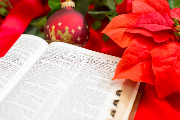 istock Nativity Red Christmas Ornament with Open Bible. 1286405347