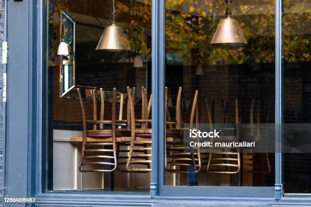 Window Of An Empty Restaurant Forced To Close Amid Covid19 Pandemic Stock Photo - Download Image Now