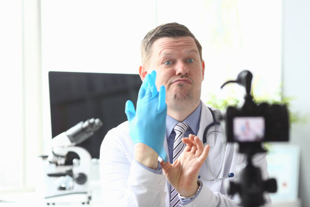 istock Male doctor broadcasts at home in front camera 1286411534
