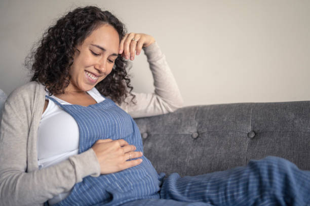 istock Pregnant woman relaxing at home 1286414363