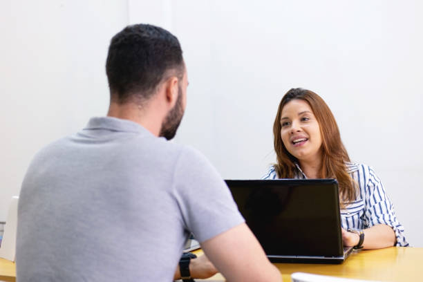 istock Man and woman at the office working together. 1286414514
