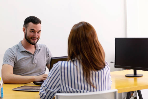 istock Man and woman at the office working together. 1286414628