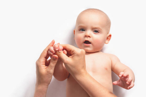 istock Baby massage. Gymnastics for small kids. Top-view. 1286415109