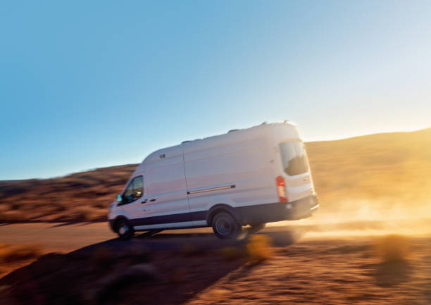 istock White commercial van speeding in the Arizona desert 1286415749