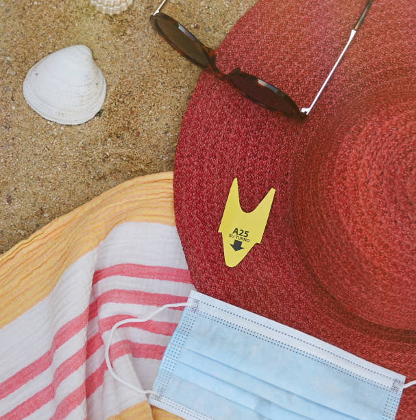 istock Chopped photograph with beach objects, hat, sunglasses, mask and number 1286420263