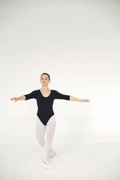 istock Ballerina posing in front of white background 1286423130